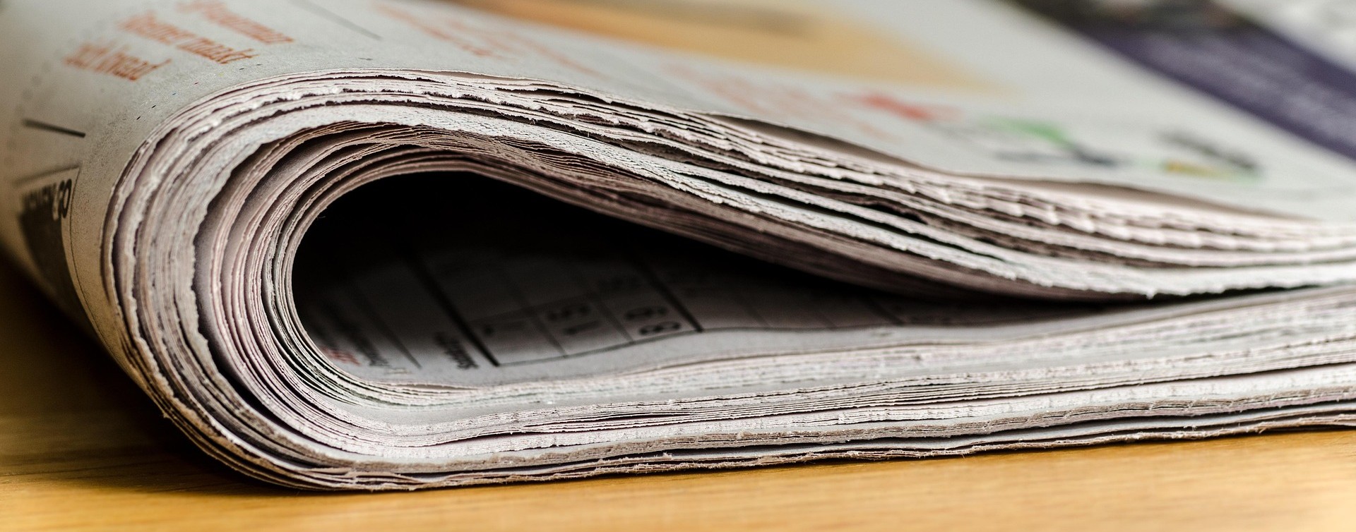 Photograph of a folded newspaper