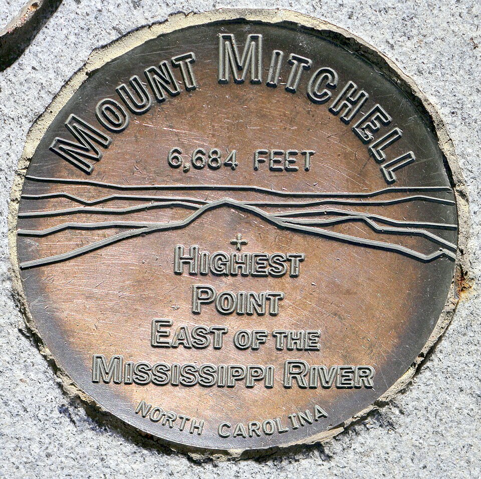 A surveyor's seal from the summit of Mt. Mitchell. Text: 
